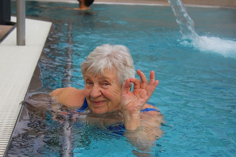 Senior woman swimming in a pool